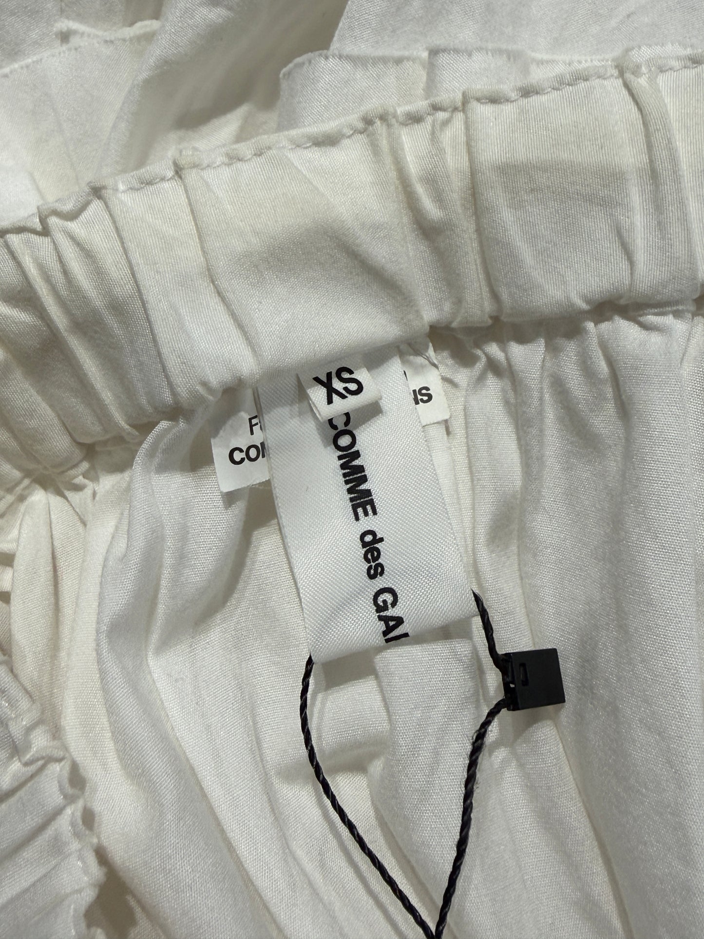 Comme des Garçons 2022 - White cotton asymmetric skirt with ruffles