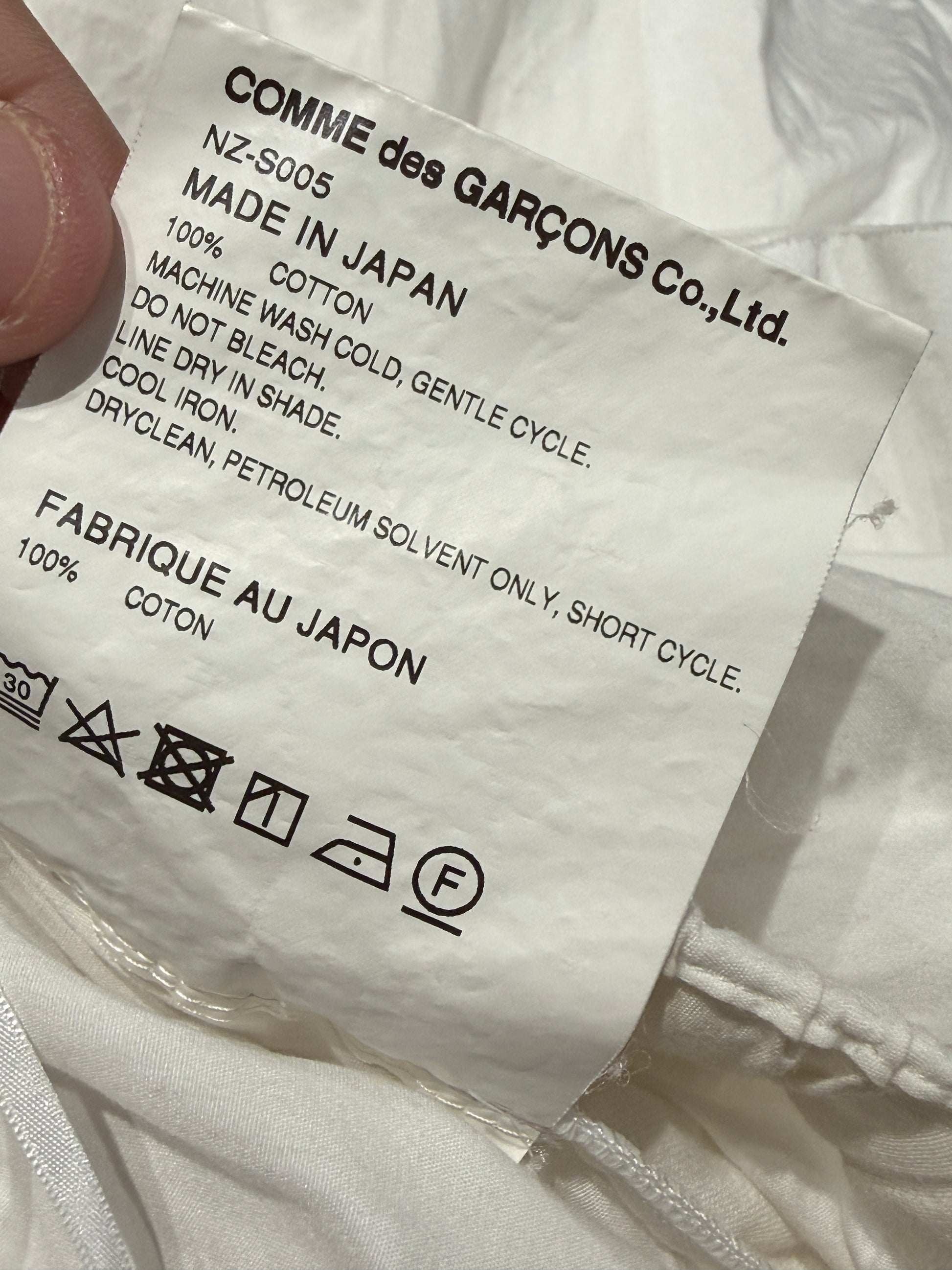 Comme des Garçons 2022 - White cotton asymmetric skirt with ruffles