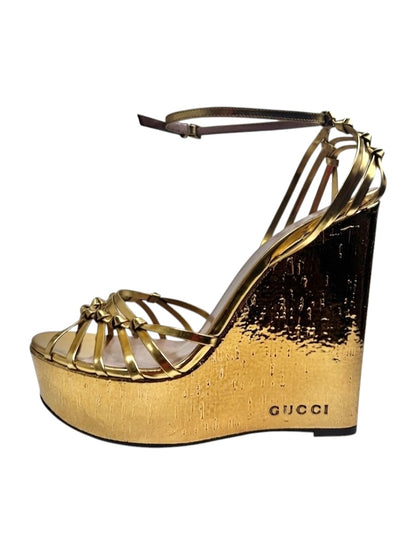 Gucci gold metallic platform 