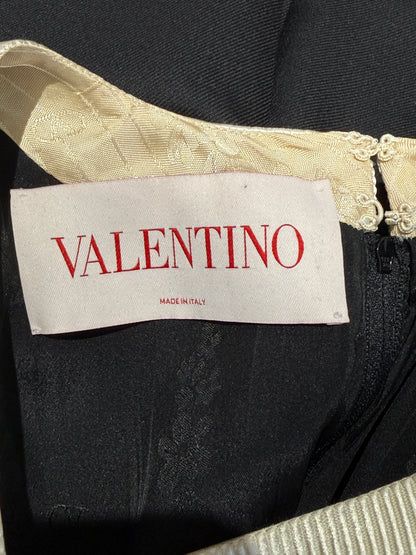 Valentino Alessandro Michele Spring 2025 Look 1 Black ruffle dress
