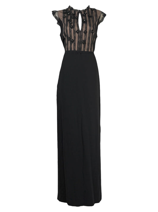 Valentino Roma  Pierpaolo Piccioli & Maria Grazia Chiuri - Spring/Summer 2011  Long sleeveless dress in black crepe, bodice embroidered with small flowers