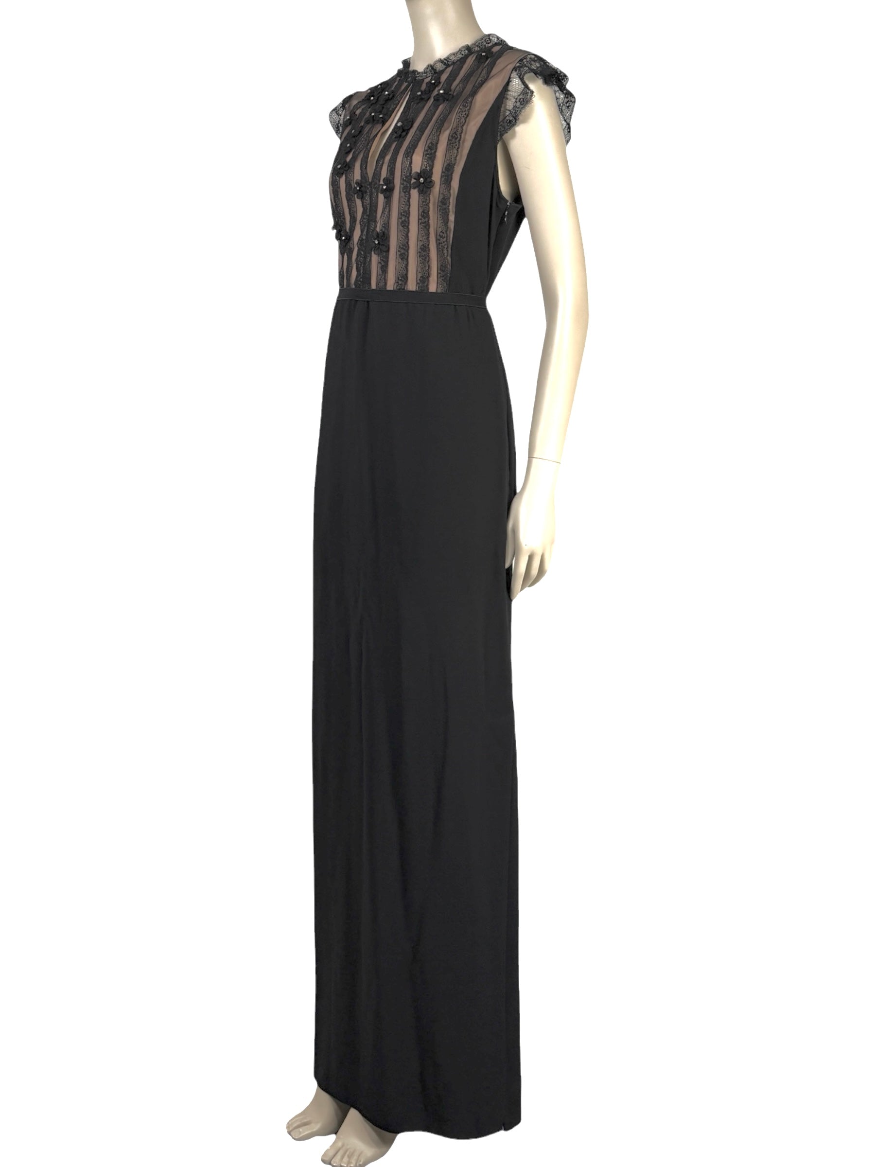 Valentino Roma  Pierpaolo Piccioli & Maria Grazia Chiuri - Spring/Summer 2011  Long sleeveless dress in black crepe, bodice embroidered with small flowers 1