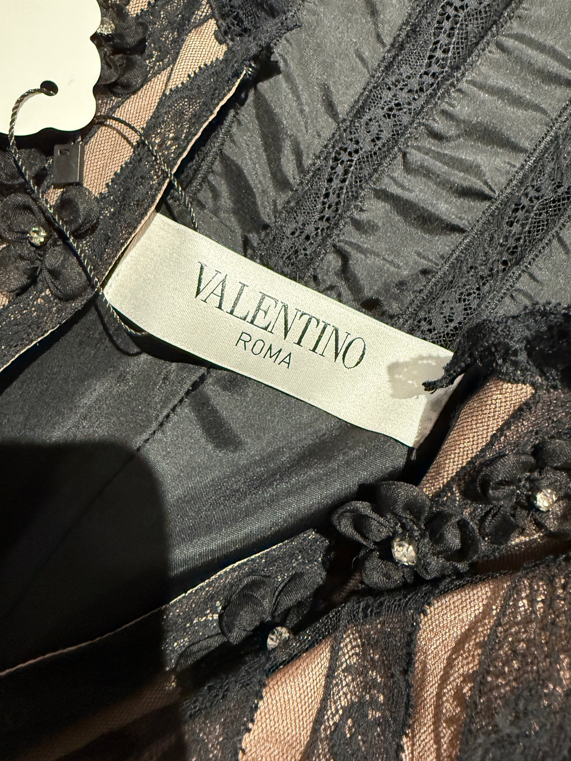 Valentino Roma  Pierpaolo Piccioli & Maria Grazia Chiuri - Spring/Summer 2011  Long sleeveless dress in black crepe, bodice embroidered with small flowers 21